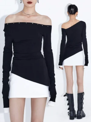 Front and back display of a fitted black asymmetric off-shoulder long-sleeve top with studded neckline and slanted hem styled with white mini skirts and buckle boots