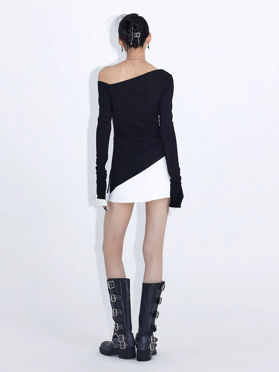 Midnight Edge black asymmetric off-shoulder streetwear top product image with fitted long sleeves, studded neckline, contrast cuffs, and angled hem