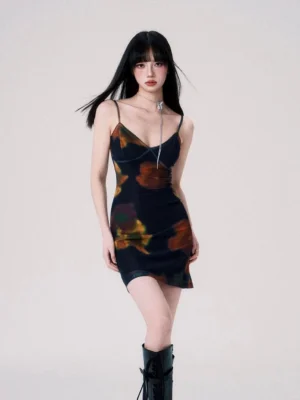 Midnight Ember floral mesh slip mini dress worn with black knee-high boots in a front full-body studio view