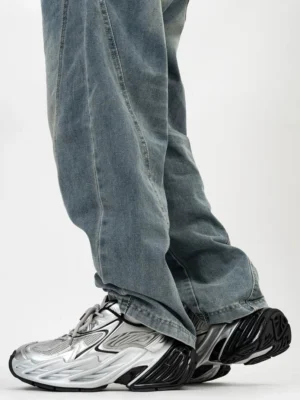 Silver and black Midnight Flux futuristic blade platform sneakers worn with baggy jeans, side profile showing angular overlays, mesh inserts and sculpted ridged outsole