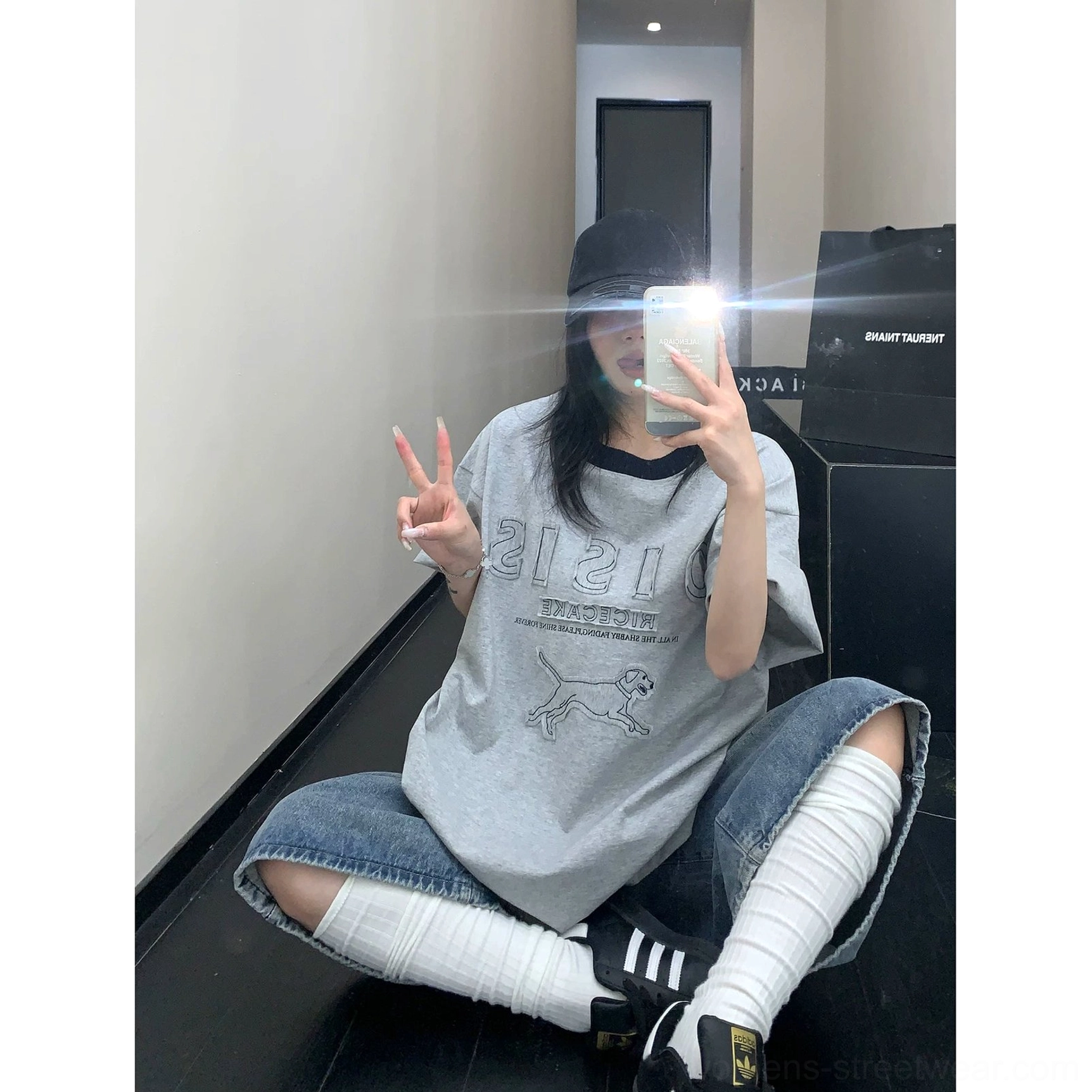 Heather gray oversized hound graphic tee paired with denim shorts and long socks in a sporty Y2K streetwear look
