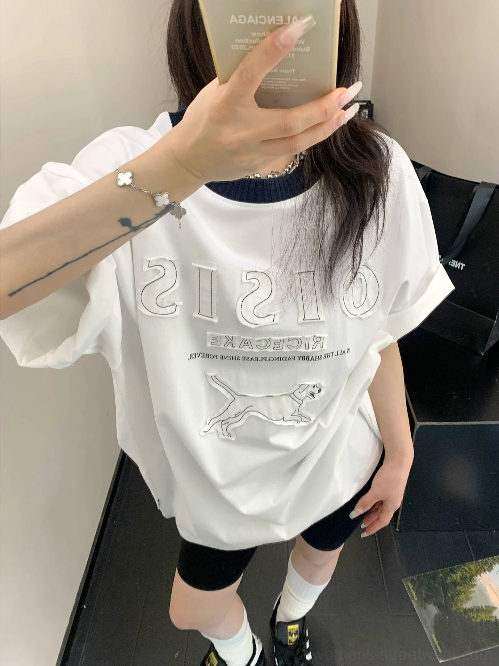 White oversized graphic streetwear T-shirt with black contrast ribbed collar and raised hound artwork