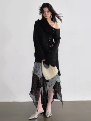 Three quarter front view of black asymmetrical ruffle maxi skirt with smoky blue grey chiffon layers and handkerchief hem