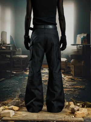 Rear view of black utility cargo flare pants showing structured back pockets and wide stacked leg silhouette