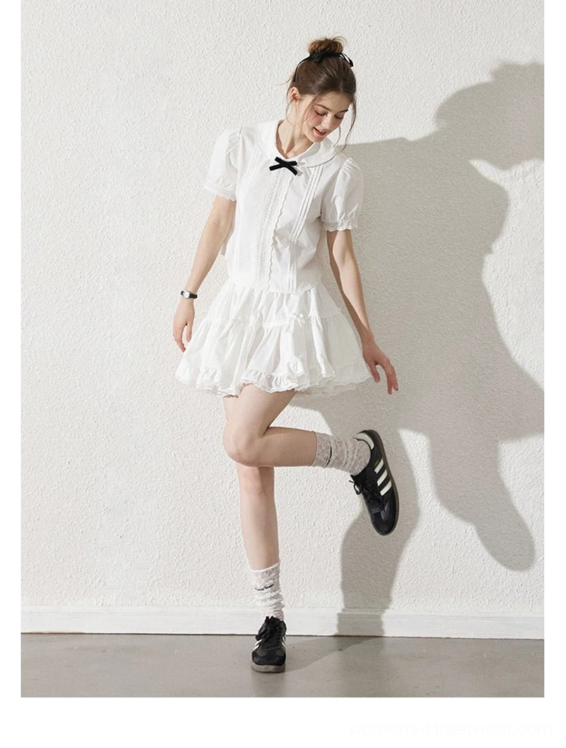 Milk white short puff sleeve Peter Pan collar blouse and ruffle skirt with sneakers side pose