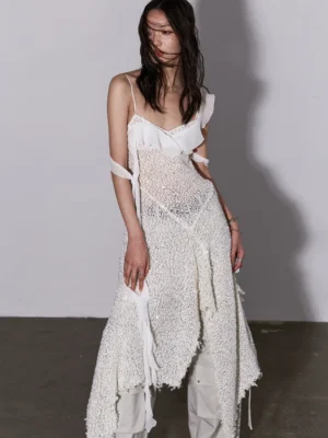 Milky white sequin mesh asymmetric layered slip dress front three quarter view with ruffled neckline and flowing strap details
