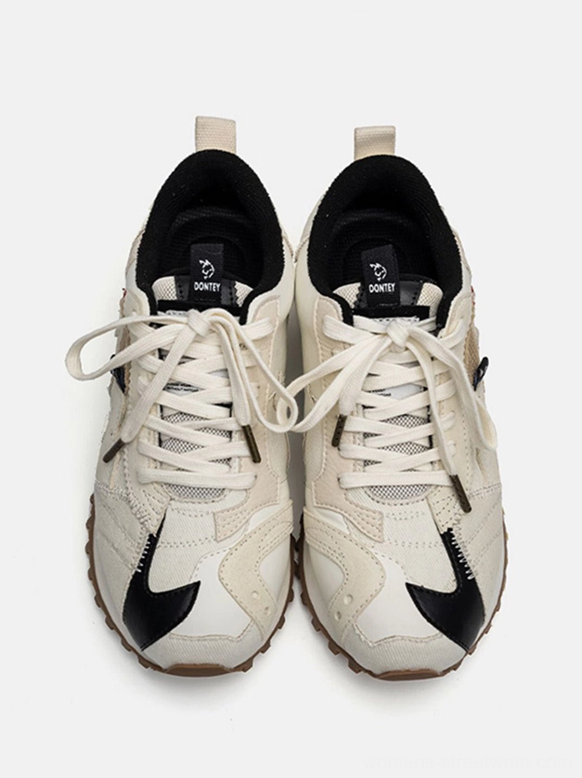 Minimal ivory retro sneakers with black contrast panels and outdoor-inspired gum waffle outsole for casual city styling