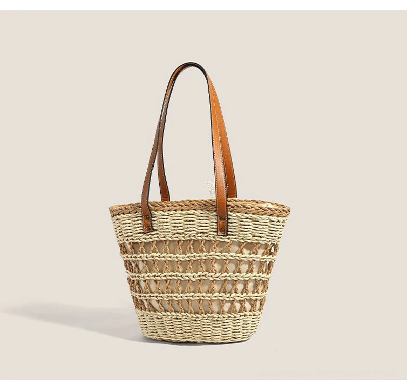 Woven straw basket tote shown without the lace bow, highlighting its clean striped texture and simple brown shoulder straps