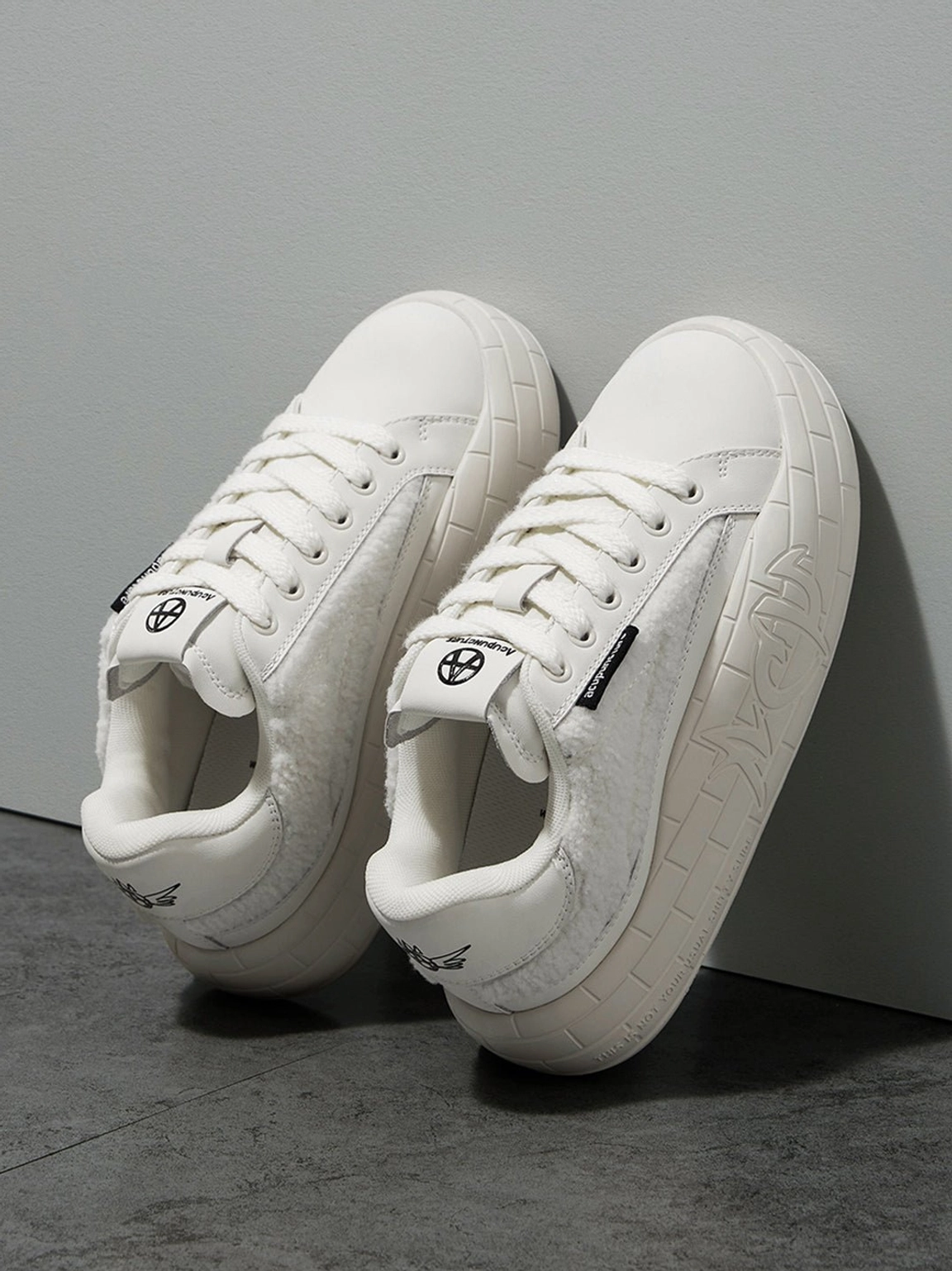 Minimalist black fleece-panel sneakers with chunky soles for casual city walks and daily wear