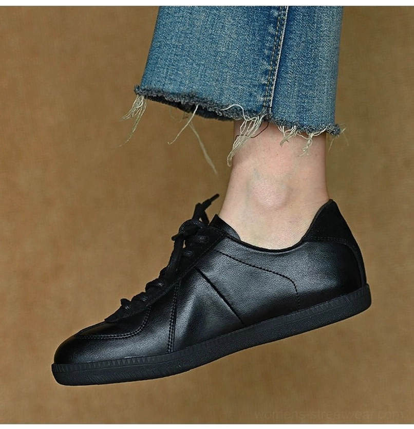Minimalist black leather low-top sneakers designed for Korean streetwear, Acubi fashion, and modern casual outfits