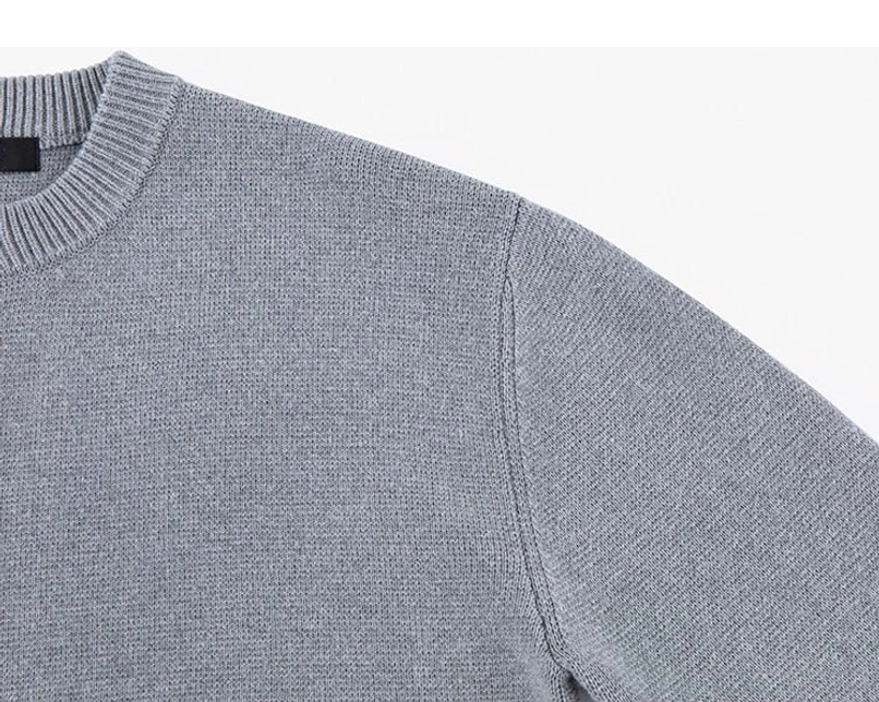Side close-up of ash gray drop shoulder wool blend knit cardigan showing dense knit texture and ribbed collar