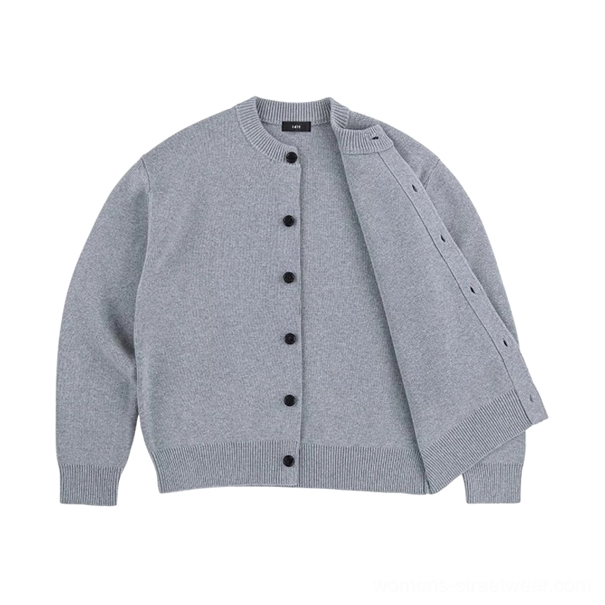 Ash gray minimalist knit cardigan displayed open with full button front and relaxed drop shoulder sleeves