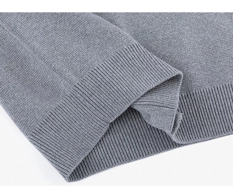 Ash gray knit cardigan ribbed cuff and hem close-up showing clean seams and soft draped knit fabric