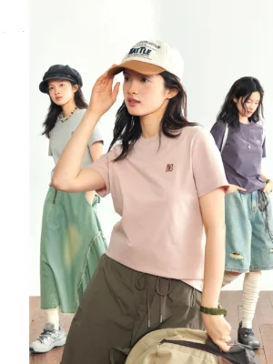 Minimalist embroidered logo crew neck t-shirt three female models casual studio streetwear group styling