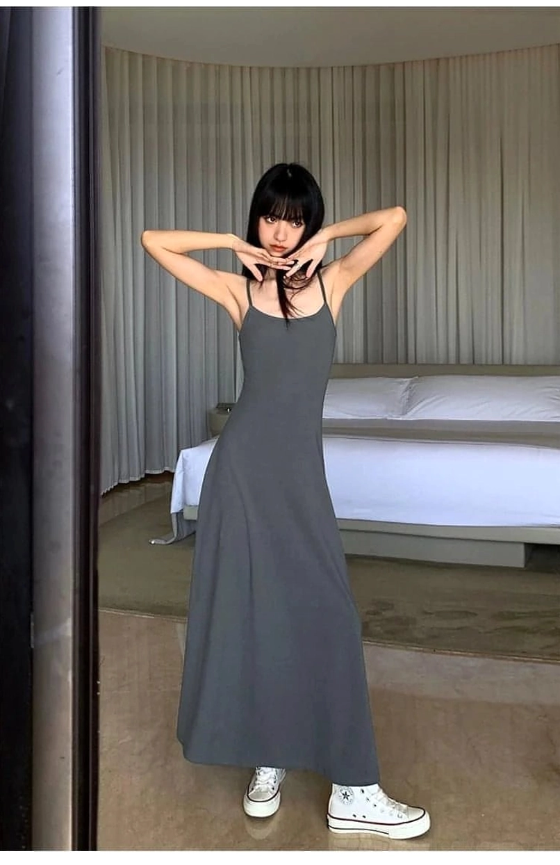 Minimalist floor length slip dress suitable for sneakers sandals boots and layered streetwear looks