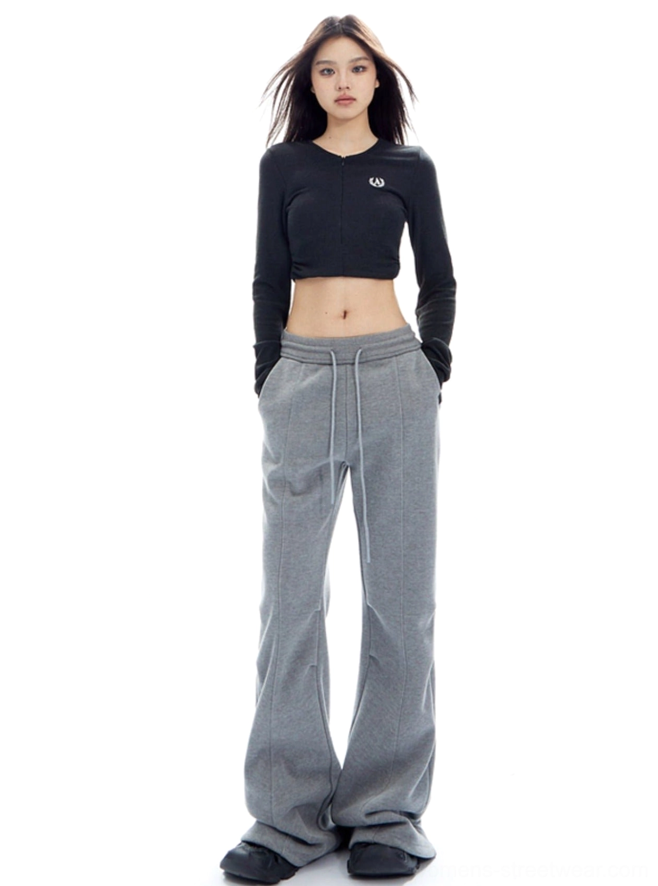 Minimalist high-waisted lounge pants with a flowing flared hem and versatile streetwear styling
