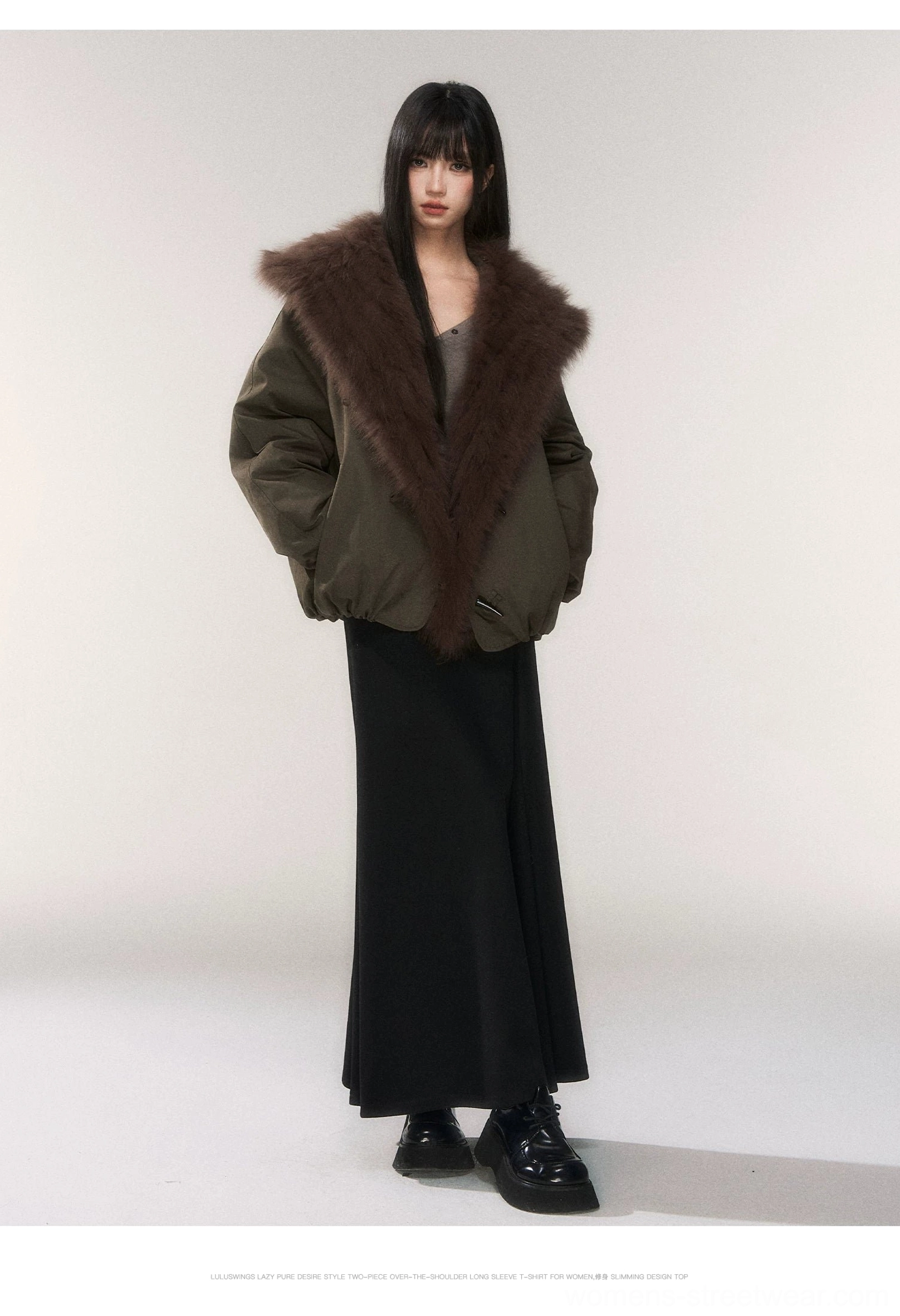 Black floor length knit fishtail maxi skirt with an olive faux fur collar cropped jacket and leather shoes in a studio fashion look