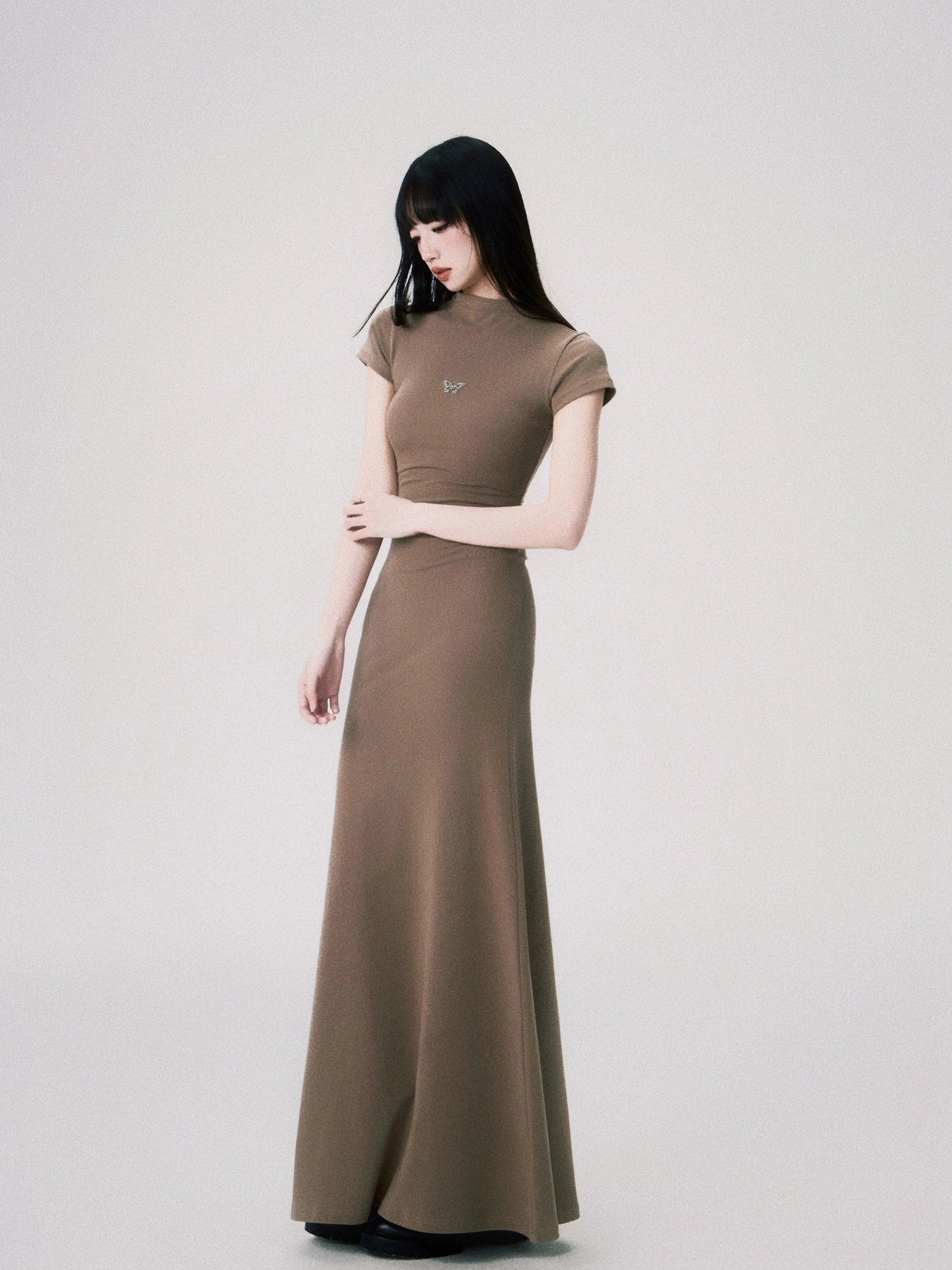 Minimalist Korean style butterfly emblem maxi dress with soft stretch knit construction and fishtail hem