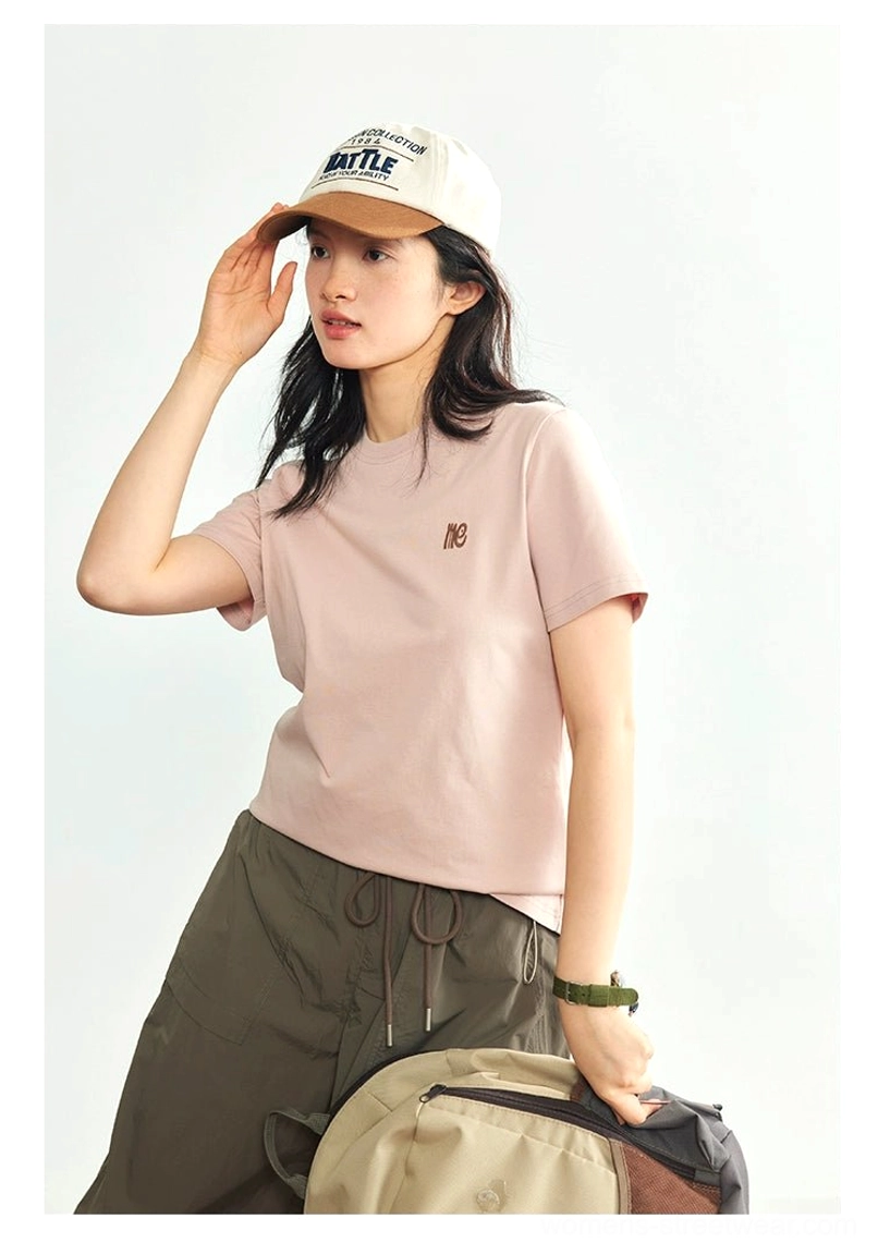 Minimalist embroidered logo crew neck t-shirt product lifestyle photography urban setting