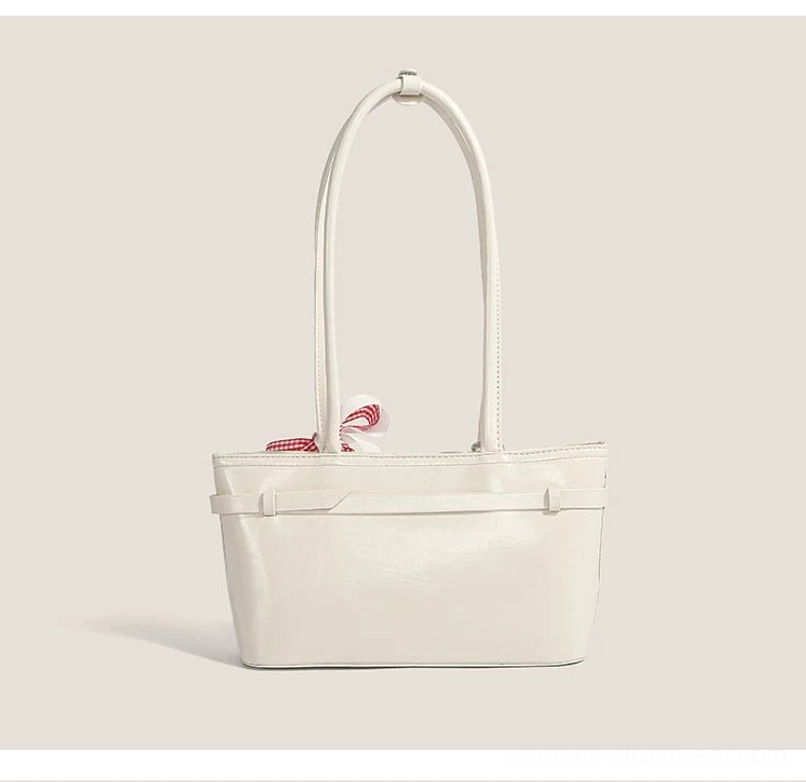 Minimalist off-white glossy faux leather underarm baguette bag with belt-inspired front detail and sleek Korean streetwear silhouette