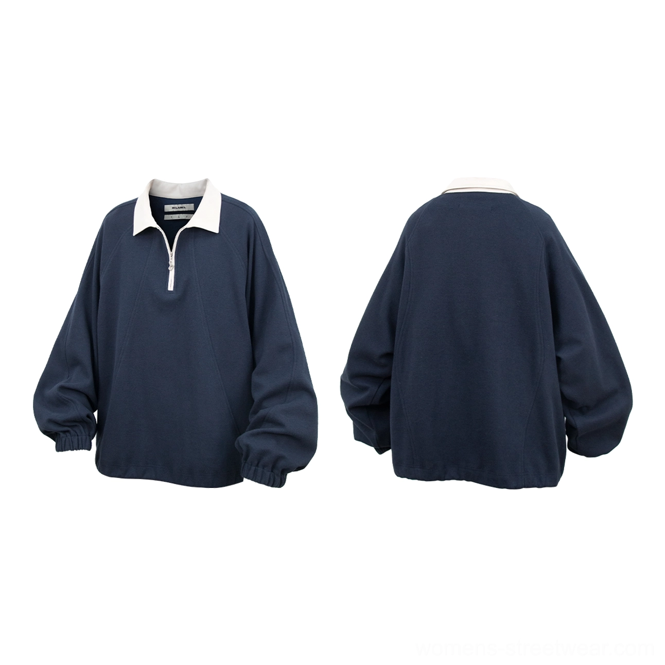 Minimalist raglan polo pullover with half-zip front and medium-weight layered fabric construction