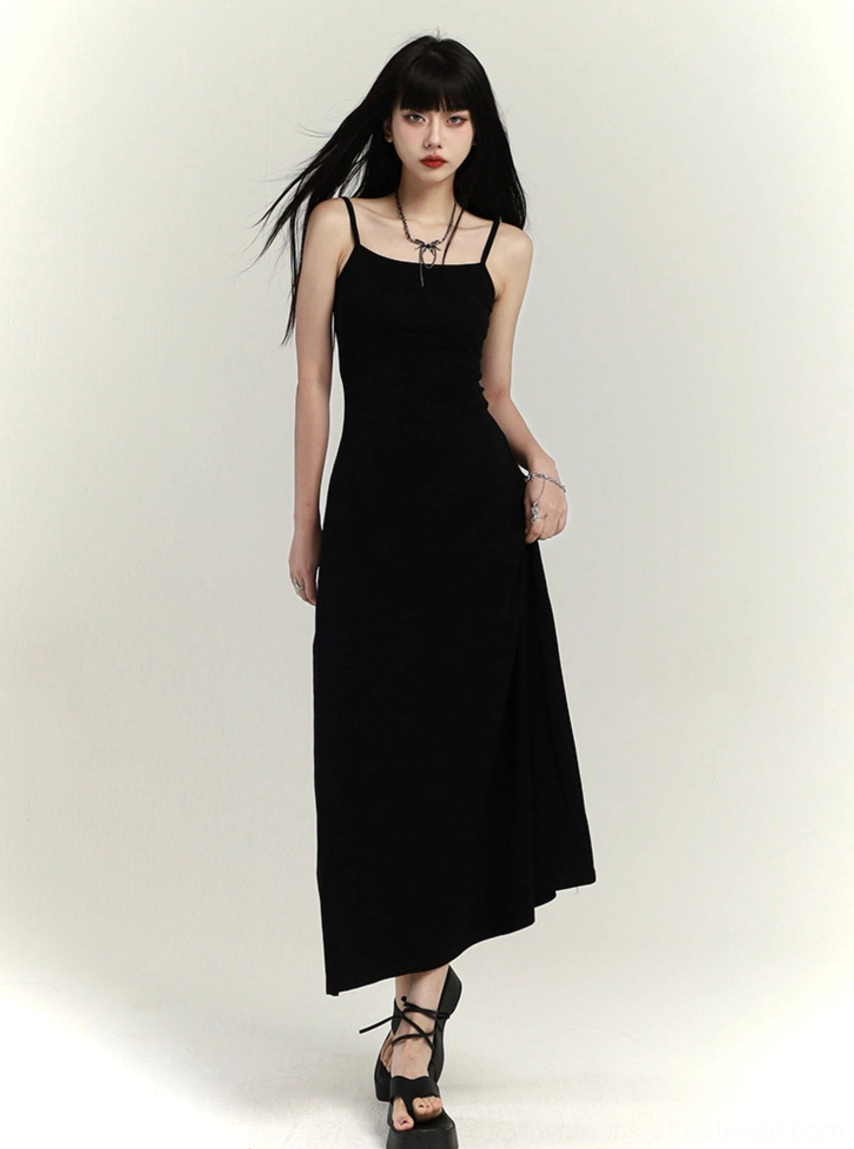 Black minimalist square neck waist-defined maxi slip dress front full body view with spaghetti straps