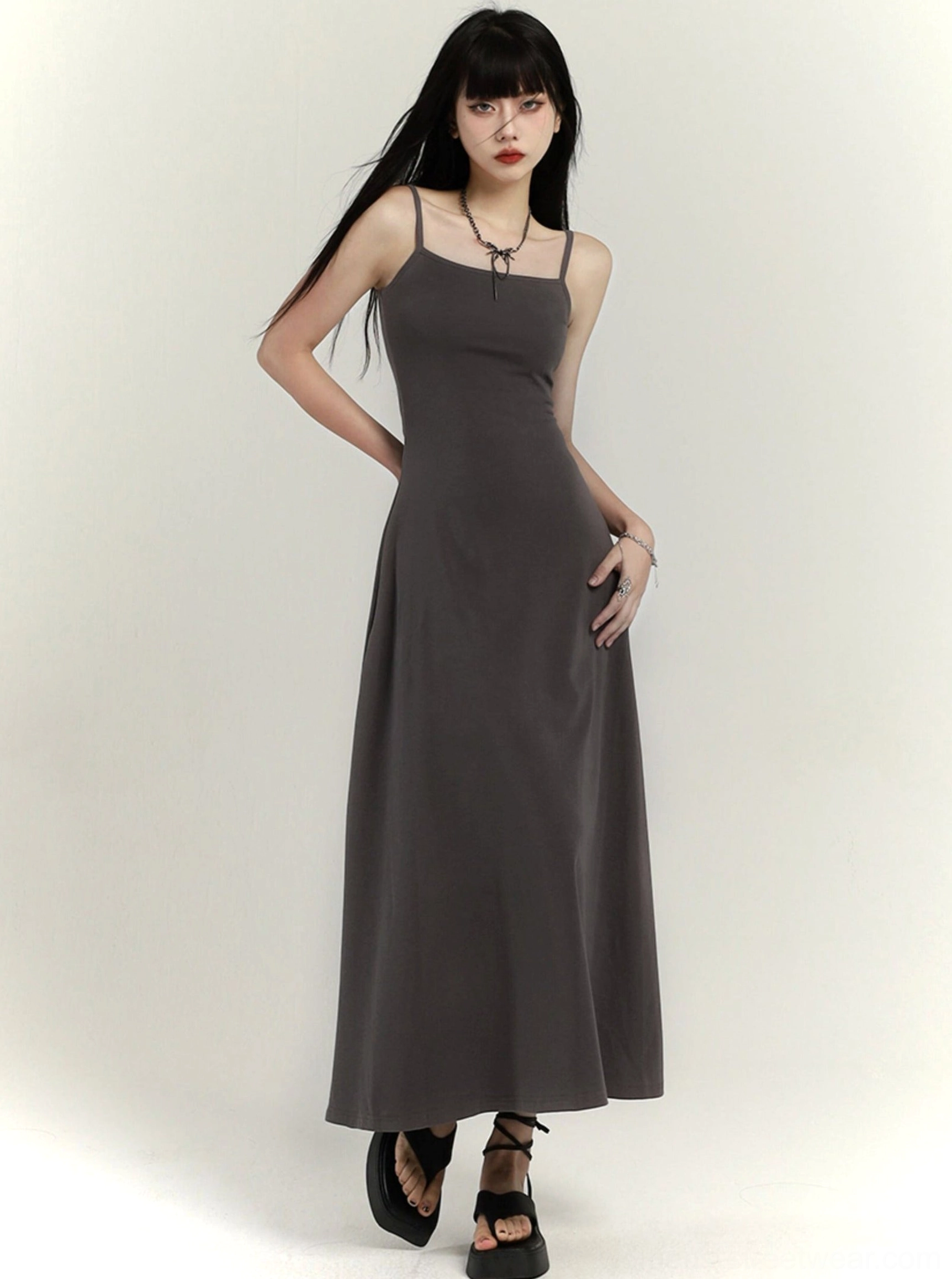 Gray spaghetti strap maxi slip dress with fitted waist and softly draped floor-length skirt