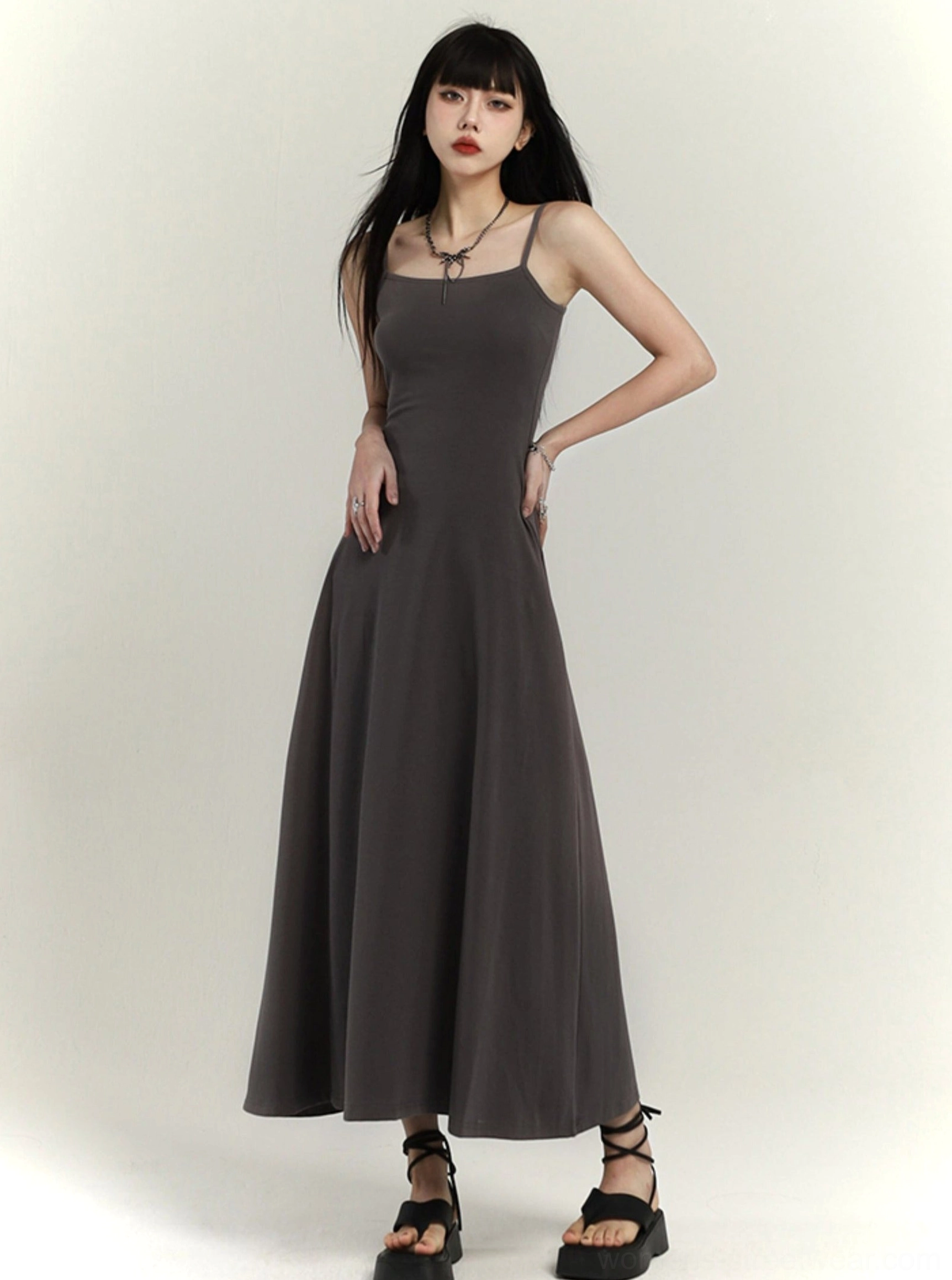 Gray waist-defined flared maxi slip dress with square neckline and delicate spaghetti straps