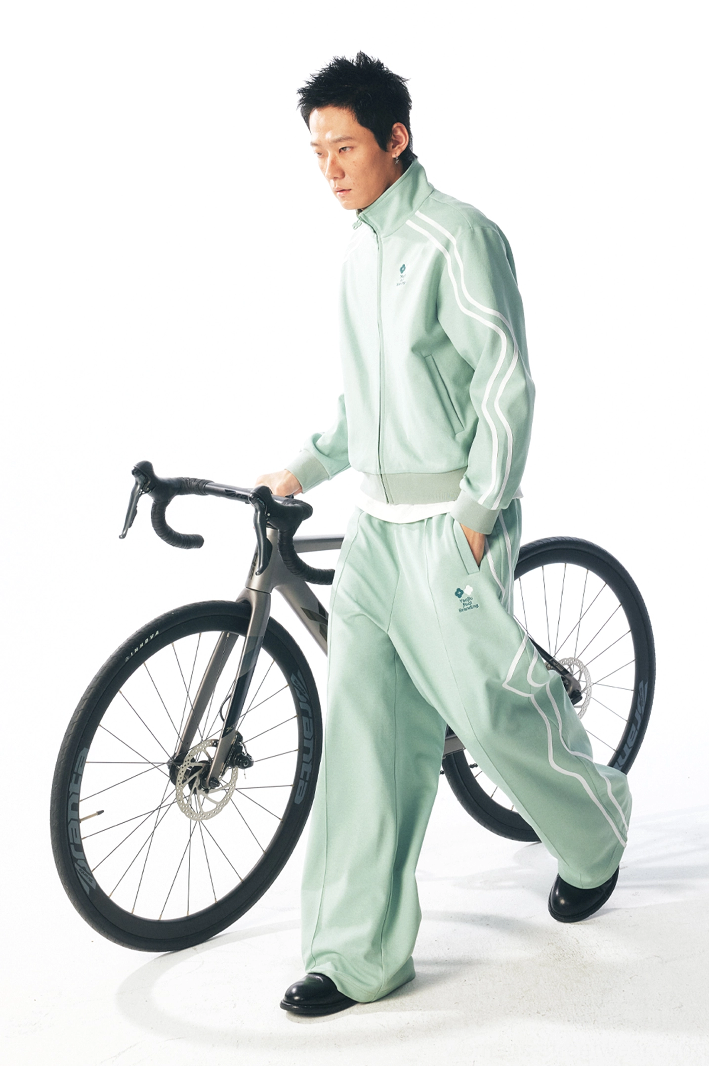 Mint green curved stripe quick-dry track pants styled with a matching jacket for an outdoor sporty streetwear look
