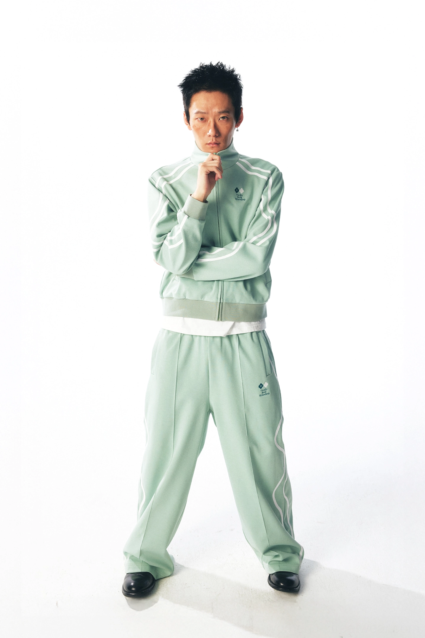 Mint green curved stripe track suit with wide-leg quick-dry pants and coordinated sporty jacket