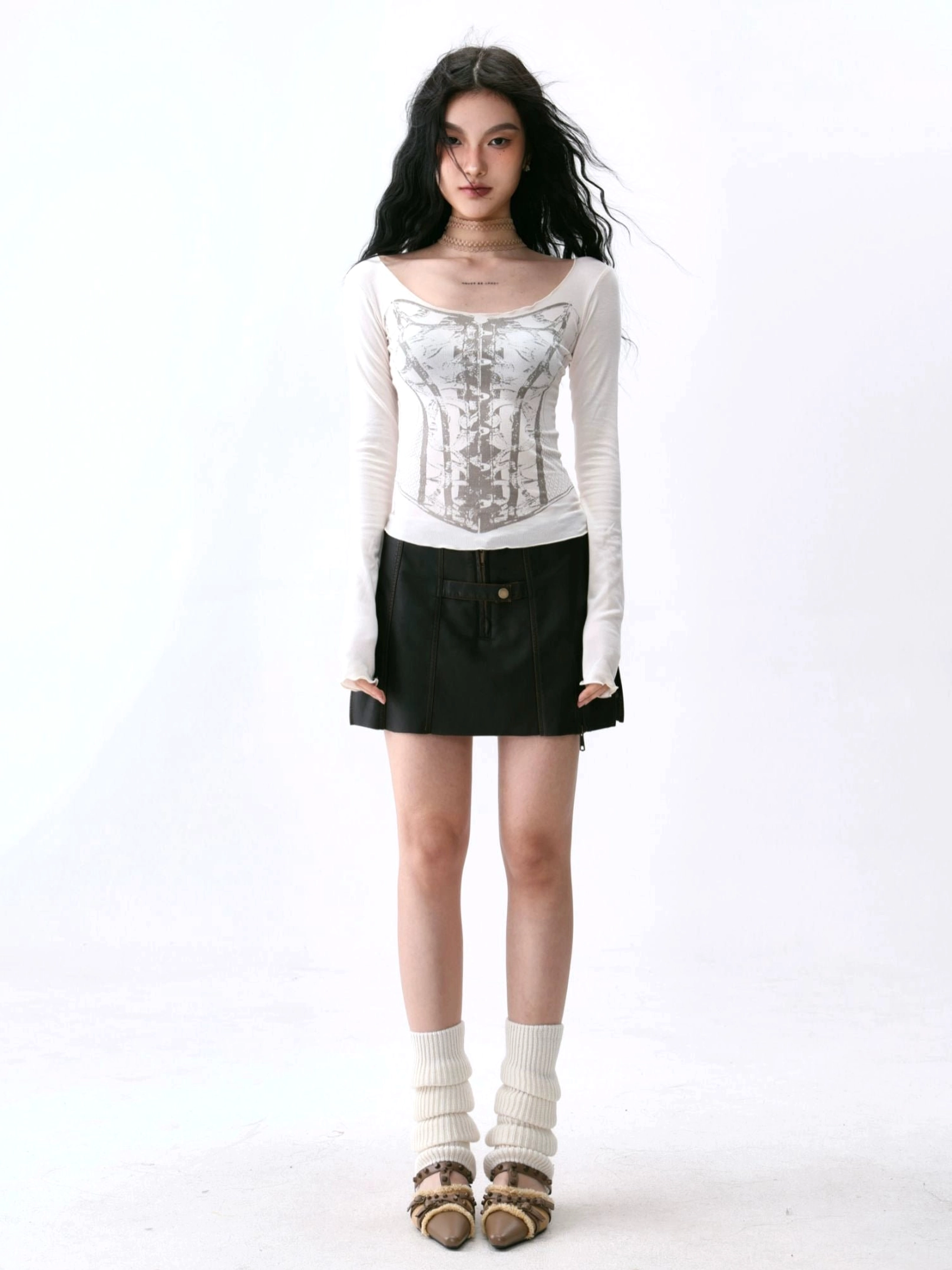 Mocha brown deep U-neck slim-fit long sleeve top with subtle corset print styled with black flare pants