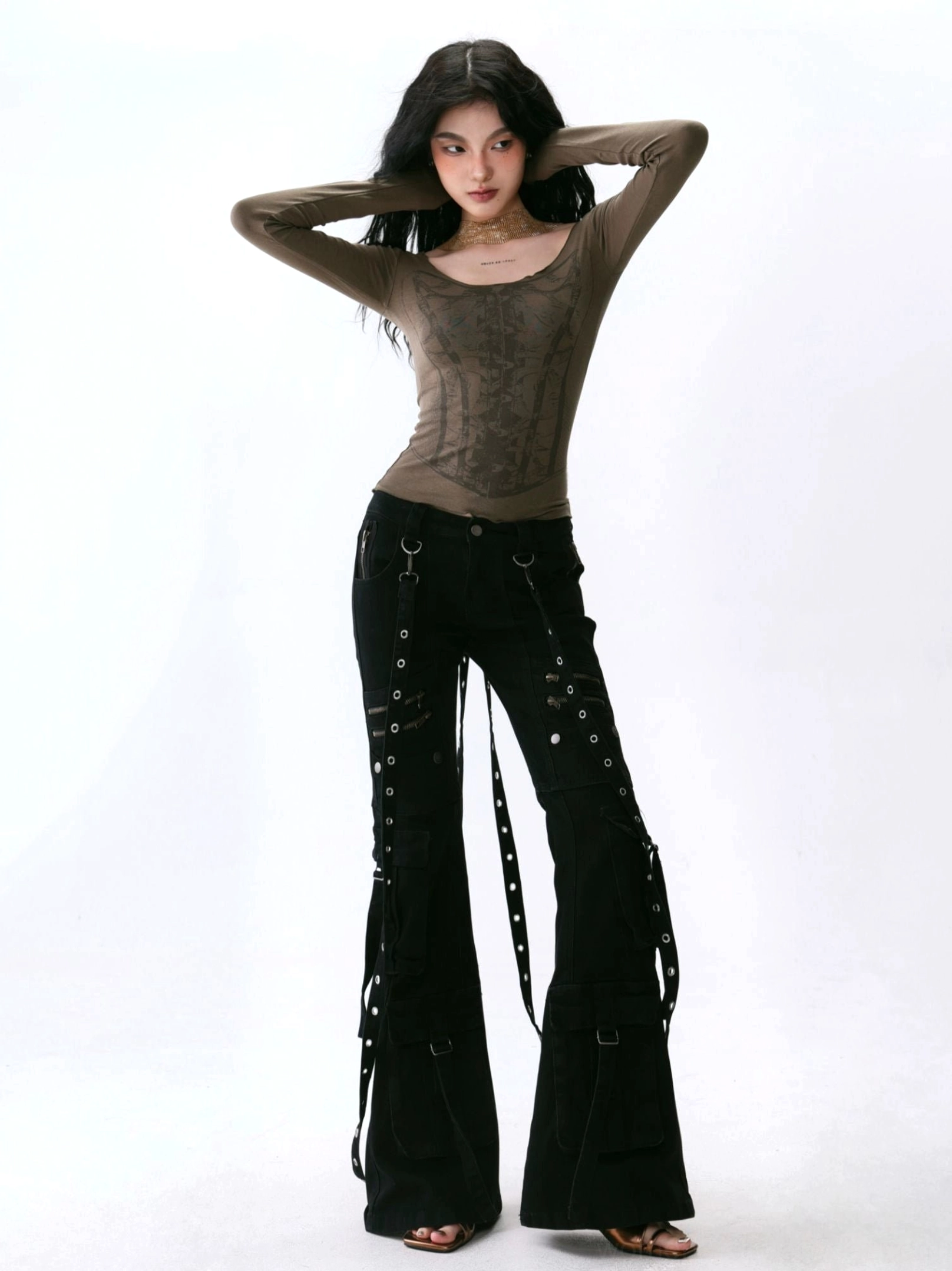 Mocha brown fitted deep U-neck corset print long sleeve top worn with black lace-up flare pants