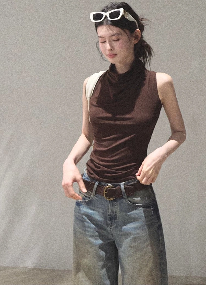 Mocha draped mock neck sleeveless slim fit top styled with wide leg blue jeans