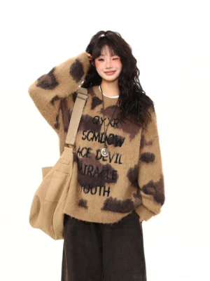 Mocha leopard fuzzy oversized graphic streetwear sweater front view styled with brown wide-leg pants