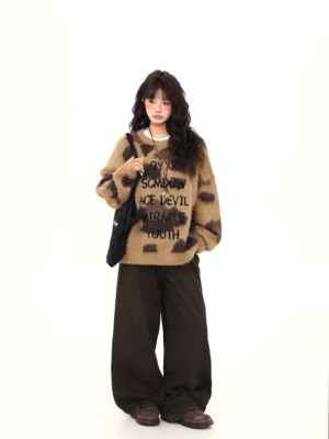Full body view of brown fuzzy graphic crew neck sweater with oversized Korean streetwear fit