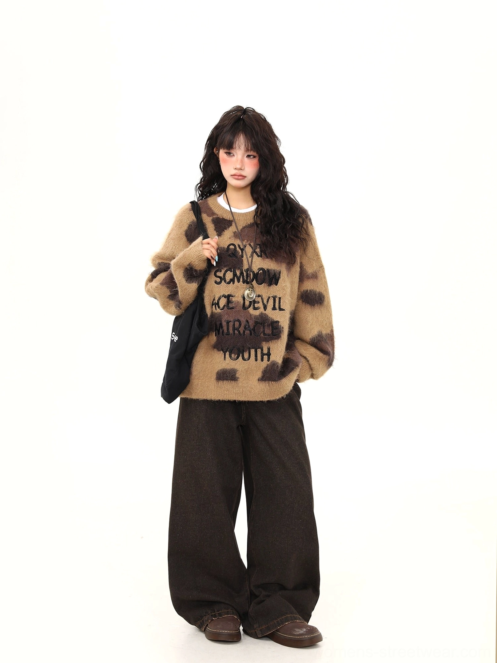 Full body view of brown fuzzy graphic crew neck sweater with oversized Korean streetwear fit