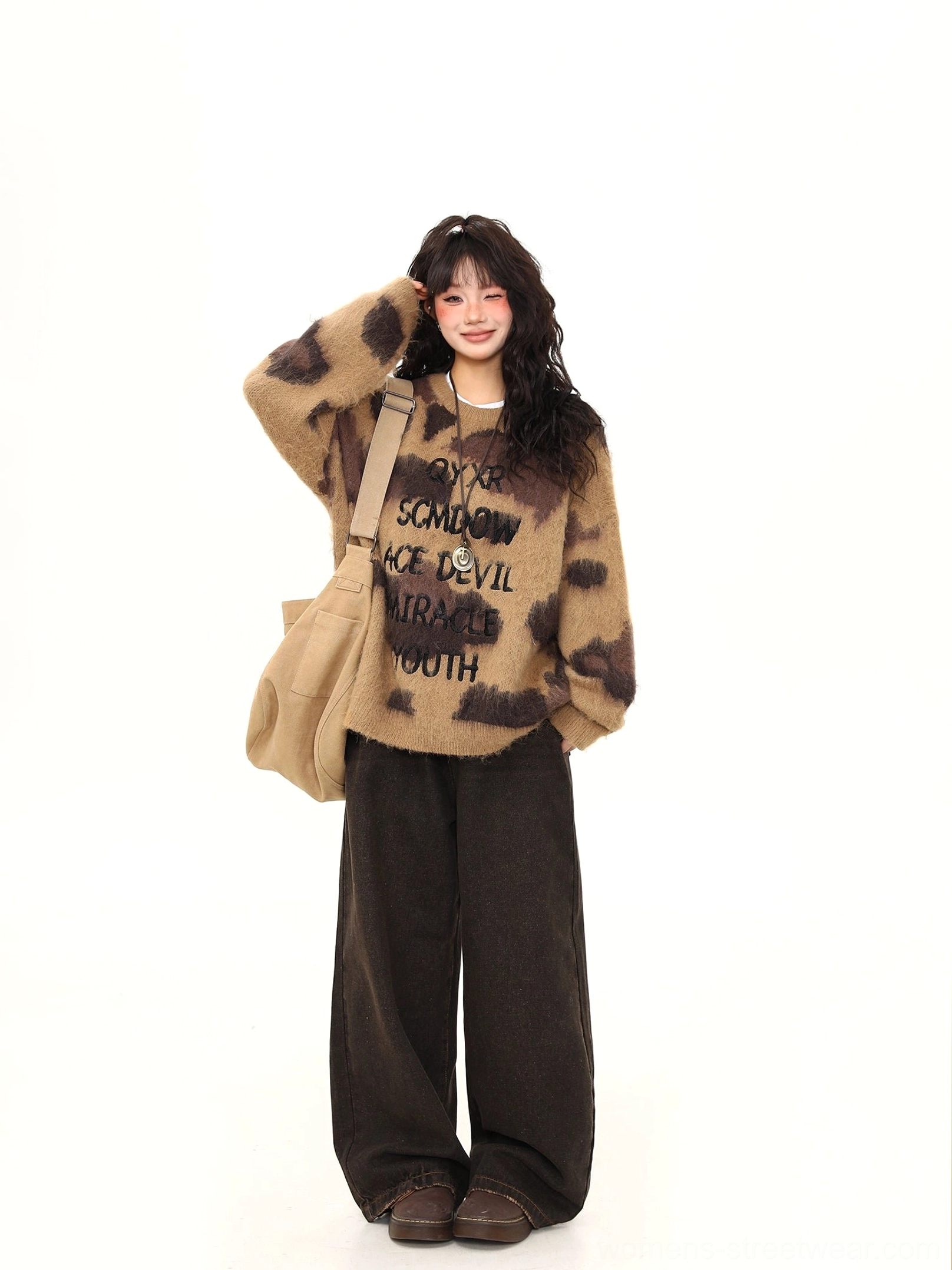 Mocha fuzzy graphic sweater angled front view showing relaxed dropped shoulder oversized silhouette