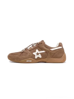 Mocha brown suede star panel retro trainer shown in a left side studio view with cream star overlay, perforated toe box, quilted stitching, and gum rubber outsole