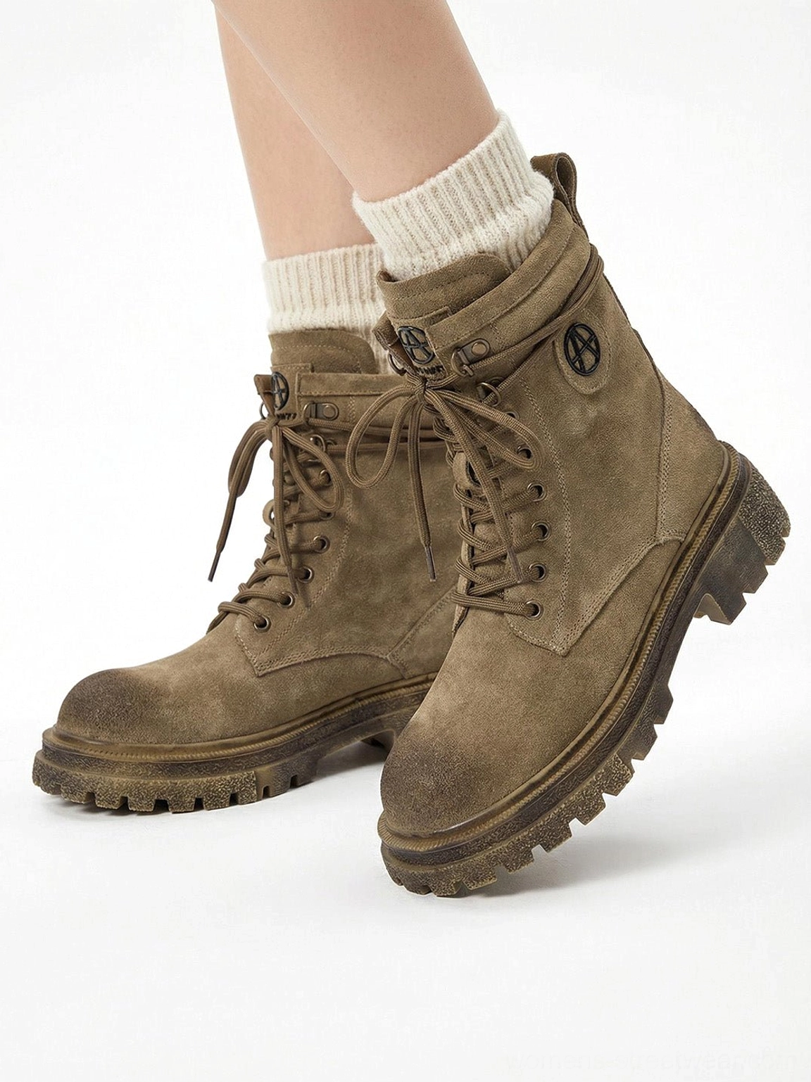 Overhead model wearing brown distressed platform combat boots with white crew socks showing on-foot elevated height effect white background