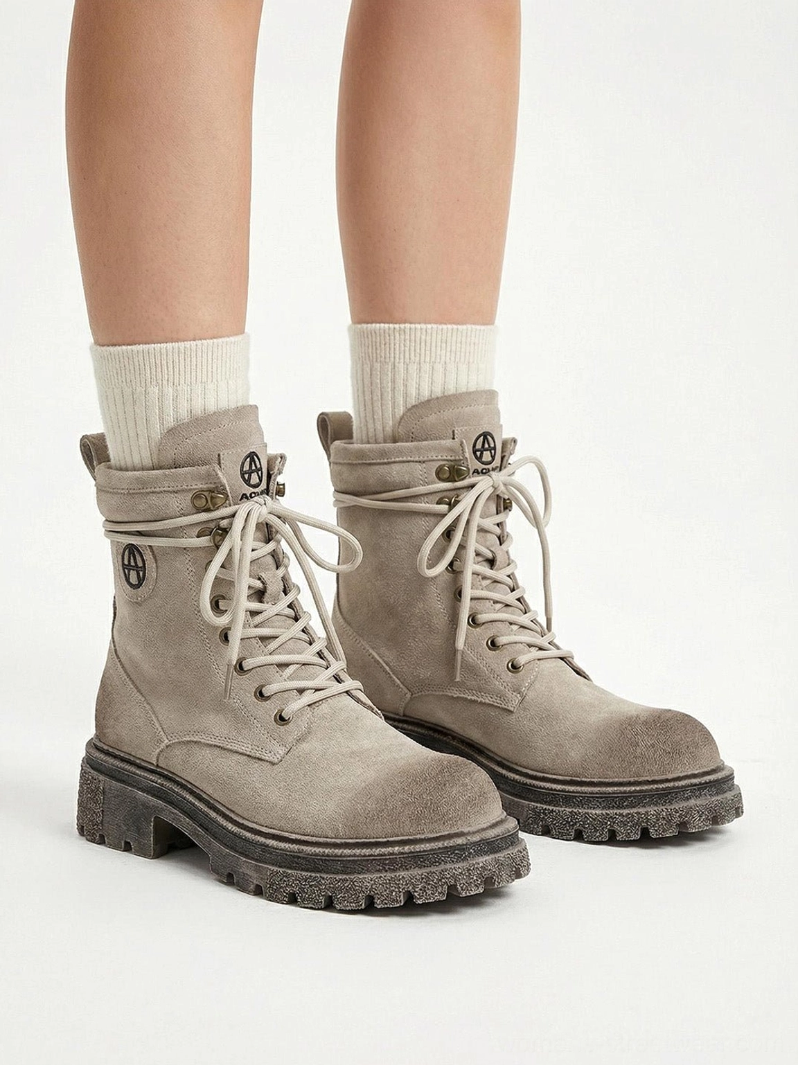Model wearing gray distressed platform combat boots showing on-body styling presentation techwear aesthetic street fashion