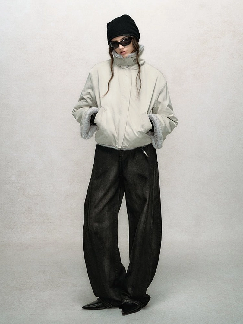 Modern cropped faux fur bomber jacket with raised collar, soft outer texture, roomy sleeves, and everyday winter styling