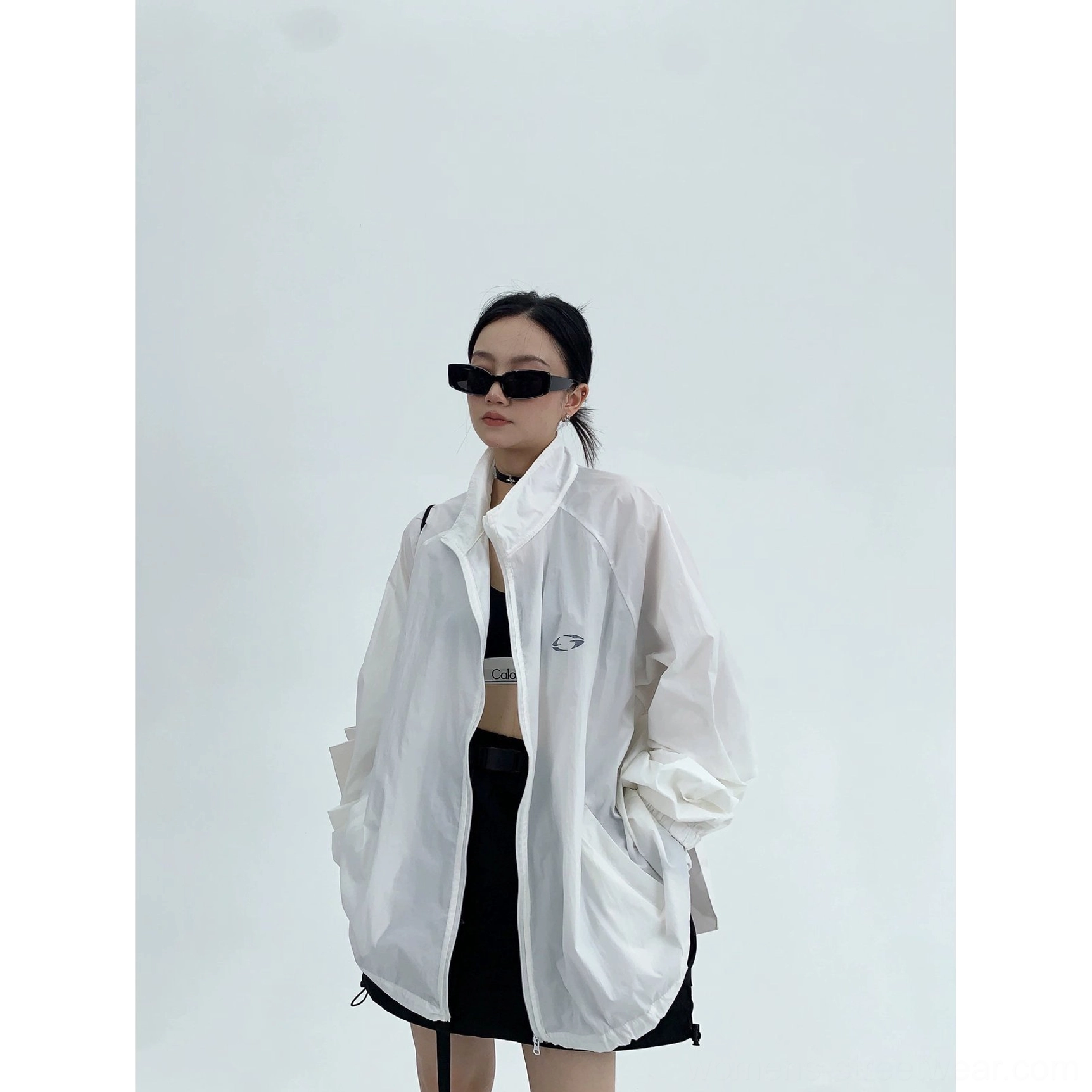 Modern Korean fashion windbreaker jacket product image featuring a loose boxy cut, lightweight shell, zip front, and understated minimalist details