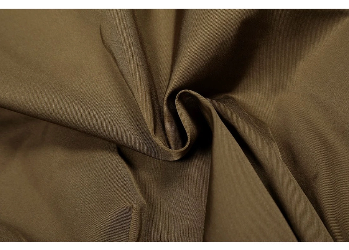 Modern olive utility bomber jacket for women featuring a cropped silhouette, high collar, epaulets, and roomy sleeves