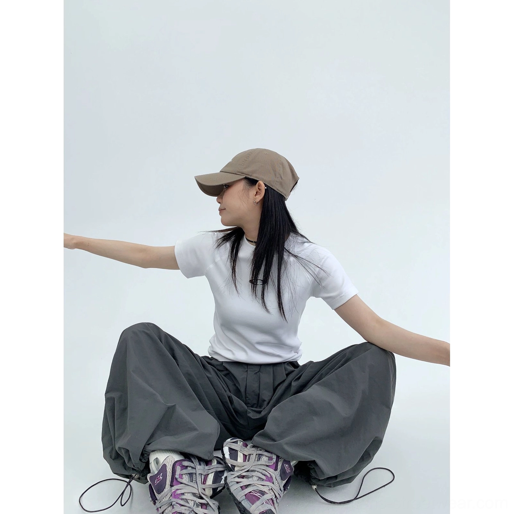 Modern oversized parachute pants with adjustable drawstring waist and dramatic wide-leg streetwear silhouette