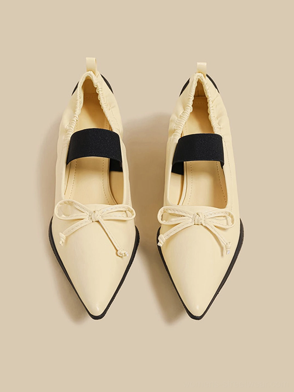 Modern pointed-toe Mary Jane mules with bow accent open back and curved sculpted heels