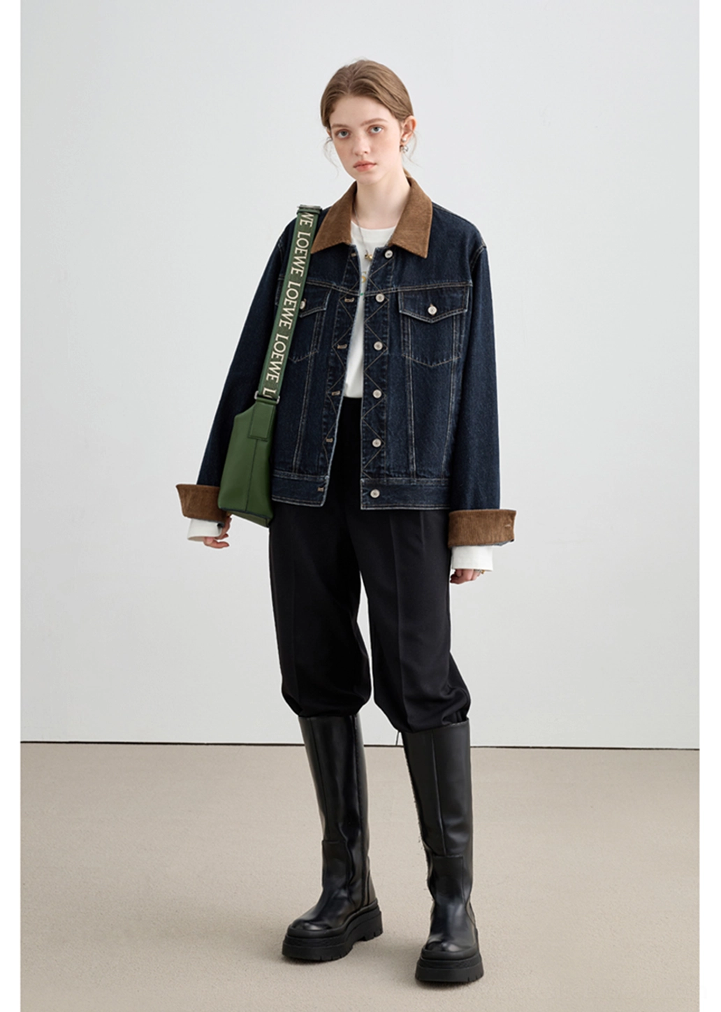 Modern streetwear denim jacket with dark indigo wash, structured collar, and relaxed boxy proportions