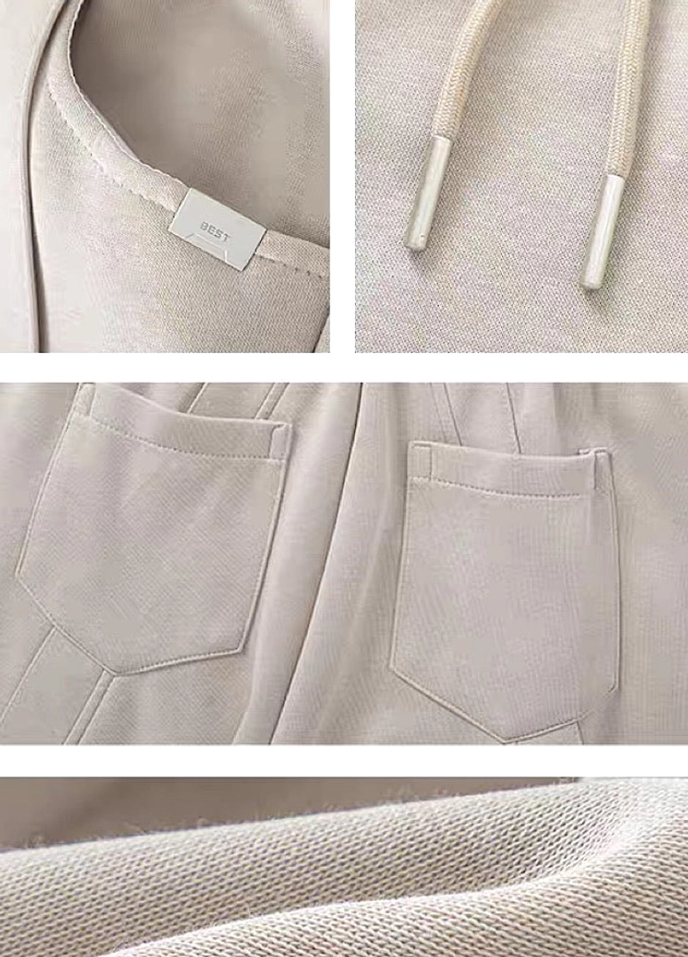 Modern washed wide-leg pants featuring adjustable drawstring waist, oversized silhouette, and minimalist streetwear design
