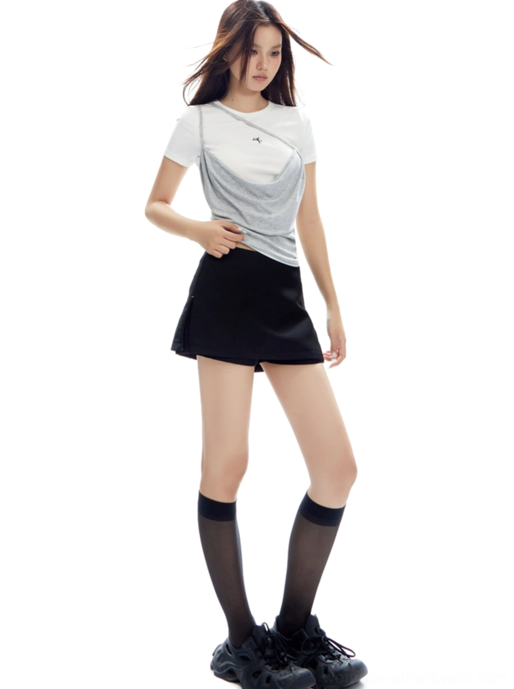 Modern women's low-rise mini skirt with sharp straight cut and versatile styling for Seoul-inspired outfits
