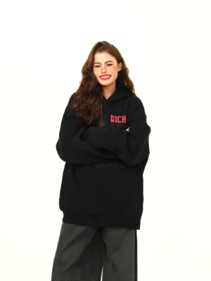 Money First black oversized streetwear hoodie with red rich graphic and grey logo typography front view