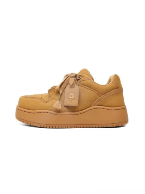 Wheat monochrome chunky platform sneakers in side view with smooth low-top upper and thick rubber sole